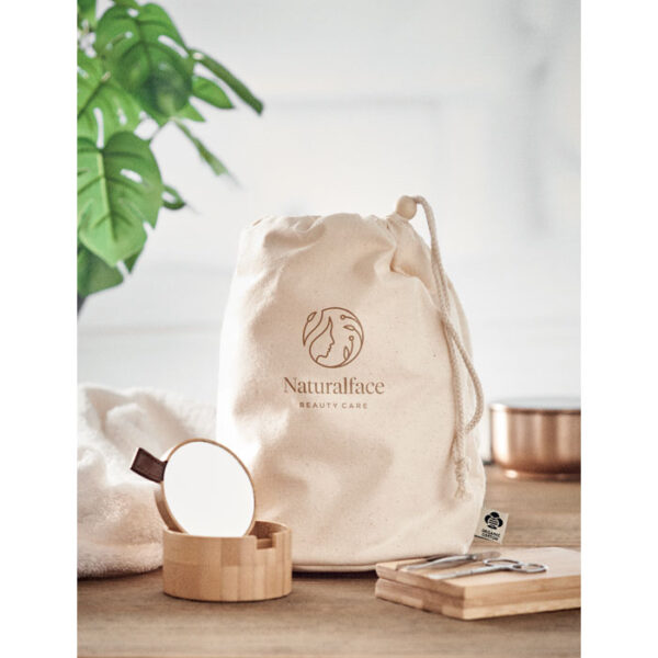 A recycled cotton drawstring bag featuring a flat design for easy storage and portability